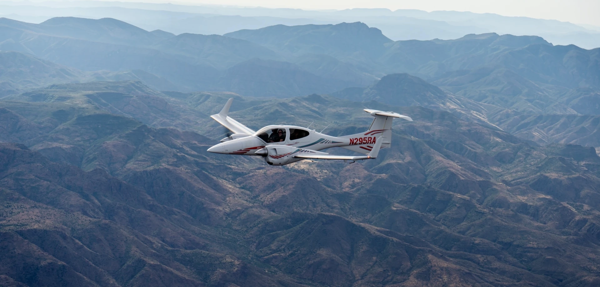SimpliFly multi-engine airplane flying over Mesa, AZ