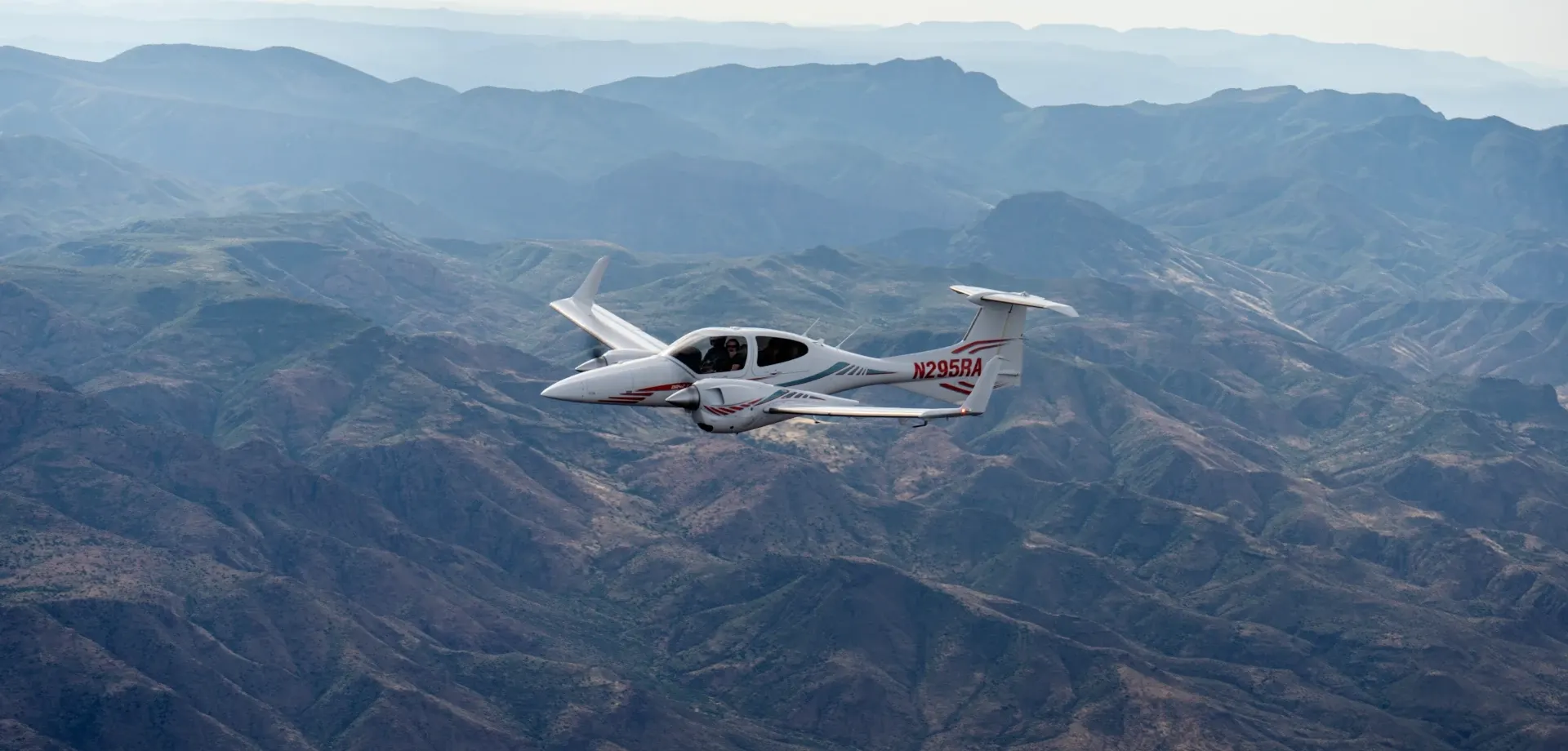 Multi-engine airplane flying over Mesa, AZ