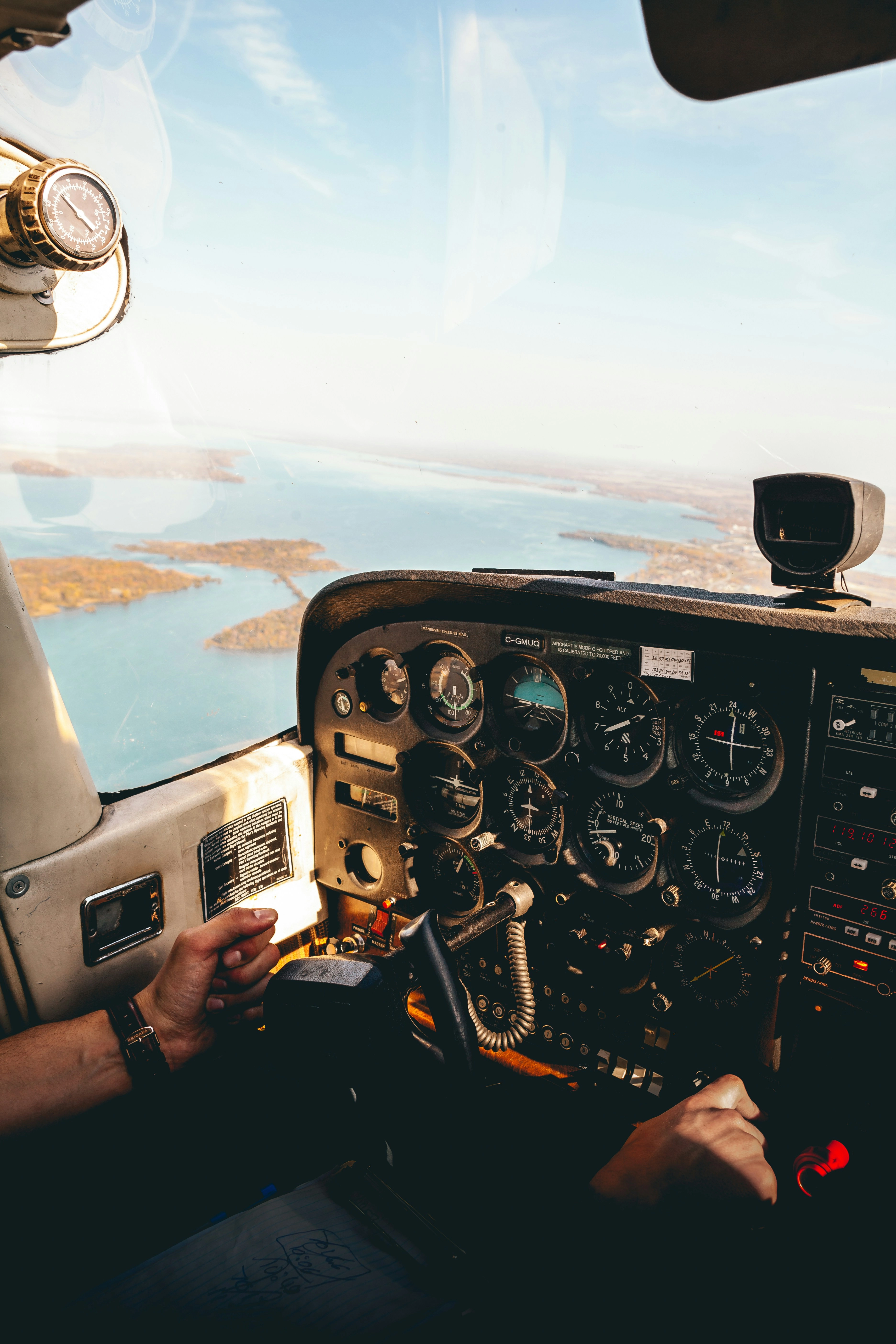 Flight instructor and student reviewing a tablet in front of a Cessna, representing digital visibility for flight schools