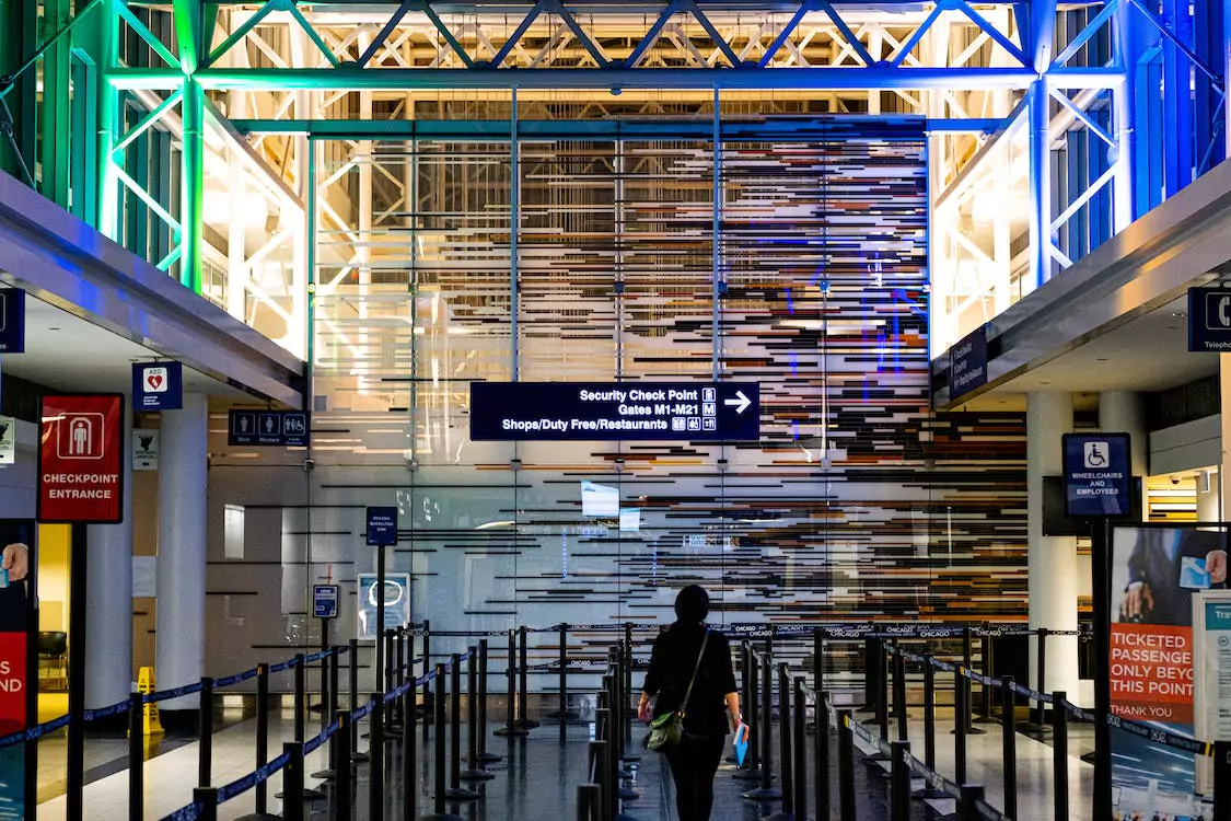 Passenger walks through empty TSA security lines at airport